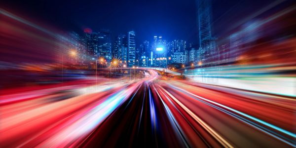 Fast-moving city lights representing accelerated MDG delivery